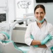 european-mid-dentist-woman-smiling-600nw-1938573190