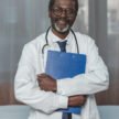 Smiling african american doctor with clipboard